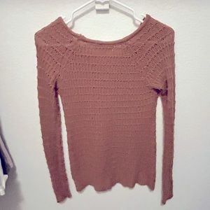Woman’s light sweater woven material.